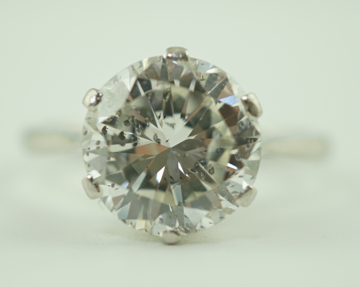 A mid 20th century platinum and solitaire diamond set ring